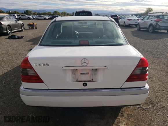 1995 Mercedes-Benz C with VIN WDBHA28E1SF151911, listed as a Copart auction lot 76814424 with 128,184 mi miles and Clean Title. Bid and sale history available at carsss.com. Image 6.