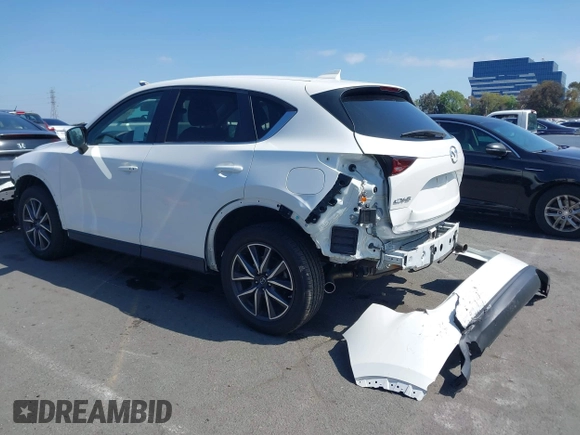 2018 Mazda CX-5 Touring with VIN JM3KFACM0J0416716, listed as a IAAI auction lot 42150121 with 61,332 mi miles and . Bid and sale history available at carsss.com. Image 3.