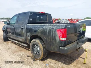2012 Nissan Titan SV with VIN 1N6AA0EK2CN306066, listed as a IAAI auction lot 42106379 with 135,556 mi miles and . Bid and sale history available at DreamBid. Image 3.