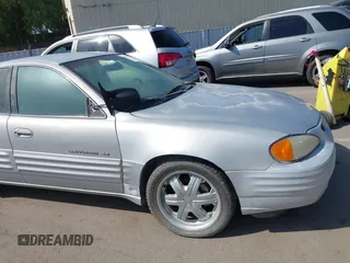 1999 Pontiac Grand Am SE with VIN 1G2NE52TXXC553246, listed as a IAAI auction lot 42398103 with Not provided miles and . Bid and sale history available at DreamBid. Image 6.