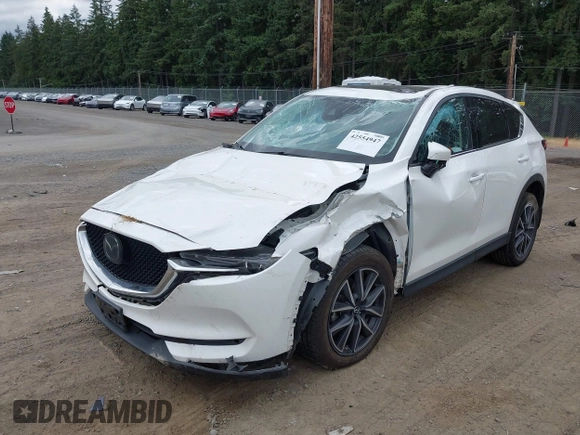 2018 Mazda CX-5 Grand Touring with VIN JM3KFBDM1J0382306, listed as a IAAI auction lot 42554947 with 121,303 mi miles and . Bid and sale history available at DreamBid. Image 2.