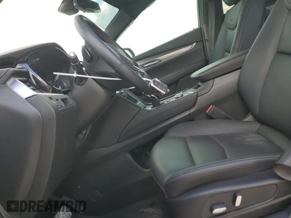 2024 Cadillac XT5 FWD Luxury with VIN 1GYKNAR42RZ731988, listed as a Copart auction lot 72777544 with 5,965 mi miles and Salvage title. Bid and sale history available at DreamBid. Image 7.