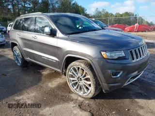 2014 Jeep Grand Cherokee Overland with VIN 1C4RJFCT8EC183165, listed as a IAAI auction lot 41298114 with 114,187 mi miles. Bid and sale history available at carsss.com. Image 1.