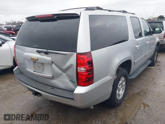 2011 Chevrolet Suburban LS with VIN 1GNSCHE06BR188407, listed as a IAAI auction lot 41453215 with 232,667 mi miles. Bid and sale history available at carsss.com. Image 4.