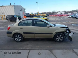 2009 Kia Rio SX with VIN KNADE223196512461, listed as a IAAI auction lot 41520063 with 132,558 mi miles. Bid and sale history available at carsss.com. Image 13.