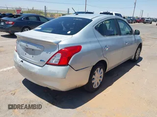 2012 Nissan Versa SV with VIN 3N1CN7AP4CL852865, listed as a IAAI auction lot 42708690 with 119,997 mi miles and . Bid and sale history available at DreamBid. Image 4.