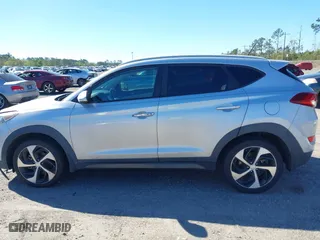 2016 Hyundai Tucson Sport with VIN KM8J33A25GU224084, listed as a IAAI auction lot 41827851 with 153,348 mi miles. Bid and sale history available at carsss.com. Image 14.