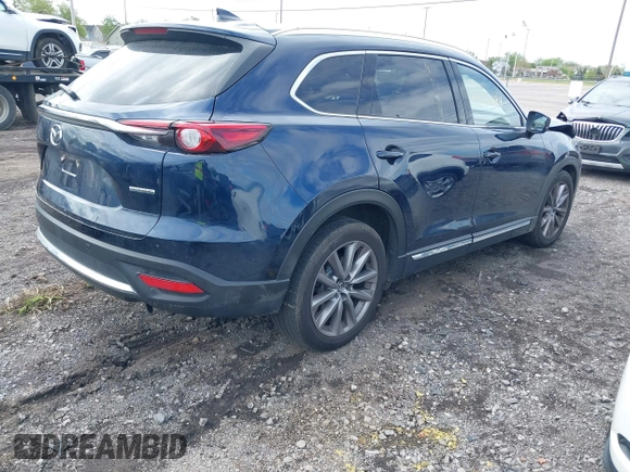 2021 Mazda CX-9 Grand Touring with VIN JM3TCBDY3M0537975, listed as a IAAI auction lot 42251894 with 50,156 mi miles and . Bid and sale history available at DreamBid. Image 4.