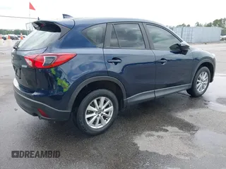 2016 Mazda CX-5 Sport with VIN JM3KE2BY0G0850298, listed as a IAAI auction lot 42107007 with 97,478 mi miles. Bid and sale history available at carsss.com. Image 4.