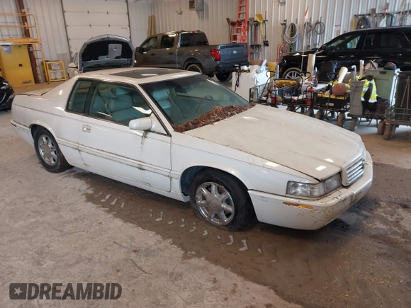 2001 Cadillac Eldorado Touring ETC z VIN 1G6ET12951B101641, wystawiony jako IAAI lot #42274235 z przebiegiem 119 965 mil mil oraz . Historia ofert i sprzedaży dostępna na DreamBid. Obrazek 1.