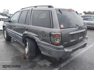 2004 Jeep Grand Cherokee Laredo with VIN 1J4GX48S14C177923, listed as a IAAI auction lot 41745772 with 242,506 mi miles. Bid and sale history available at carsss.com. Image 3.