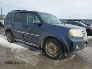 2010 Honda Pilot Touring with VIN 5FNYF4H99AB501127, listed as a Copart auction lot 52602285 with 271,602 mi miles and Salvage Title. Bid and sale history available at carsss.com. Image 4.