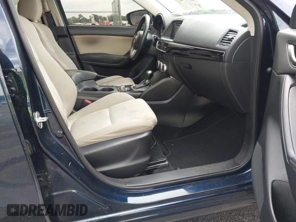 2016 Mazda CX-5 Sport with VIN JM3KE2BY0G0850298, listed as a IAAI auction lot 42107007 with 97,478 mi miles. Bid and sale history available at carsss.com. Image 5.