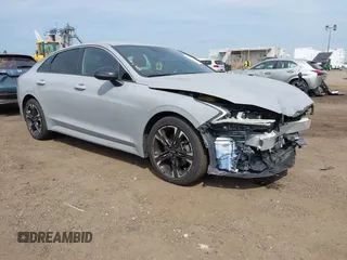 2023 Kia K5 GT-Line z VIN 5XXG64J26PG176483, wystawiony jako IAAI lot #42154614 z przebiegiem 61 050 mil mil oraz . Historia ofert i sprzedaży dostępna na DreamBid. Obrazek 1.