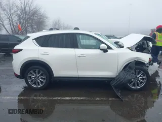 2020 Mazda CX-5 Grand Touring with VIN JM3KFBDMXL0785865, listed as a IAAI auction lot 41567177 with 64,519 mi miles. Bid and sale history available at carsss.com. Image 13.