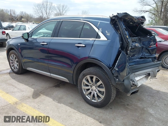 2021 Cadillac XT4 AWD Premium Luxury z VIN 1GYFZDR45MF048569, wystawiony jako IAAI lot #41902941 z przebiegiem 53 891 mil mil oraz . Historia ofert i sprzedaży dostępna na DreamBid. Obrazek 3.