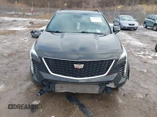 2021 Cadillac XT4 AWD Sport with VIN 1GYFZFR49MF065225, listed as a IAAI auction lot 41191994 with 58,095 mi miles and . Bid and sale history available at DreamBid. Image 6.