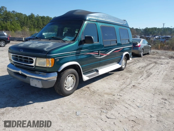 1999 Ford Econoline Cargo with VIN 1FDRE14W2XHB18989, listed as a IAAI auction lot 41740961 with 152,028 mi miles. Bid and sale history available at carsss.com. Image 2.