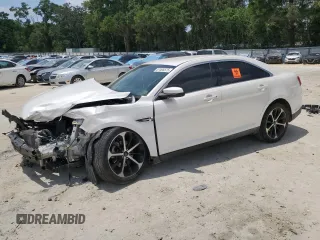 2016 Ford Taurus SEL z VIN 1FAHP2E86GG138691, wystawiony jako Copart lot #57495575 z przebiegiem Nie podano mil oraz Szkoda całkowita • Salvage title. Historia ofert i sprzedaży dostępna na DreamBid. Obrazek 1.