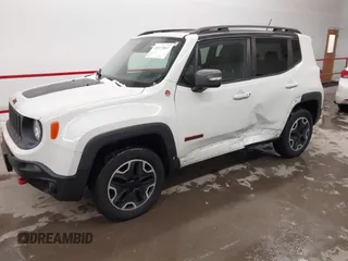 2015 Jeep Renegade Trailhawk with VIN ZACCJBCT2FPC33277, listed as a IAAI auction lot 41571863 with 98,912 mi miles and . Bid and sale history available at DreamBid. Image 2.