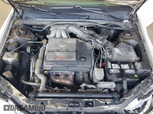 2003 Toyota Avalon XL z VIN 4T1BF28B53U321615, wystawiony jako Copart lot #52852895 z przebiegiem 218 633 mil mil oraz Szkoda całkowita • Salvage title. Historia ofert i sprzedaży dostępna na DreamBid. Obrazek 11.
