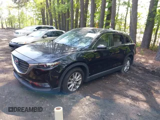 2016 Mazda CX-9 Sport with VIN JM3TCABY8G0112981, listed as a IAAI auction lot 42093389 with 106,384 mi miles. Bid and sale history available at carsss.com. Image 2.
