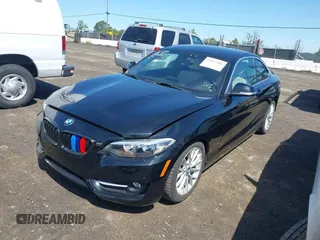 2016 BMW 2 Series 228i with VIN WBA1F9C5XGV545664, listed as a IAAI auction lot 39327505 with 94,583 mi miles. Bid and sale history available at carsss.com. Image 6.