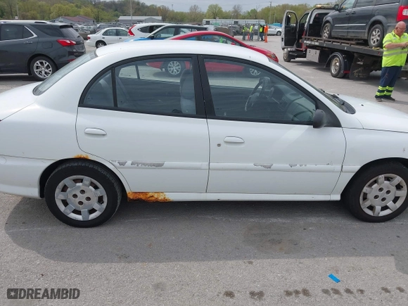 2002 Kia Rio with VIN KNADC123926185376, listed as a IAAI auction lot 42027348 with 84,893 mi miles. Bid and sale history available at carsss.com. Image 6.