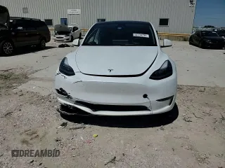 2023 Tesla Model Y Long Range z VIN 7SAYGDEE1PA155629, wystawiony jako Copart lot #52234735 z przebiegiem 24 944 mil mil oraz Szkoda całkowita • Salvage title. Historia ofert i sprzedaży dostępna na DreamBid. Obrazek 11.