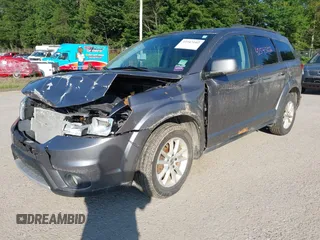 2013 Dodge Journey SXT with VIN 3C4PDDBGXDT607052, listed as a IAAI auction lot 42543102 with 157,325 mi miles and . Bid and sale history available at DreamBid. Image 2.