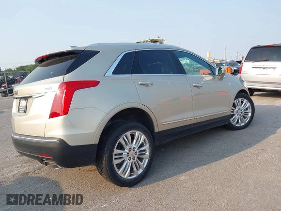 2017 Cadillac XT5 Premium Luxury FWD z VIN 1GYKNCRSXHZ164468, wystawiony jako IAAI lot #40314503 z przebiegiem 94 008 mil mil oraz . Historia ofert i sprzedaży dostępna na DreamBid. Obrazek 4.
