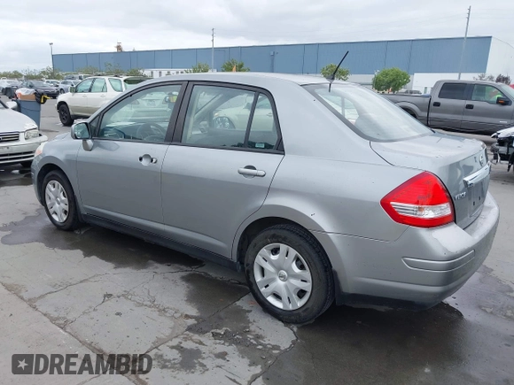 2011 Nissan Versa 1.8 S with VIN 3N1BC1AP0BL461824, listed as a IAAI auction lot 42076994 with 180,798 mi miles. Bid and sale history available at carsss.com. Image 3.