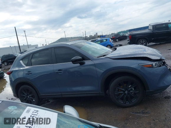 2024 Mazda CX-5 S Carbon Edition z VIN JM3KFBCL1R0470051, wystawiony jako IAAI lot #42088186 z przebiegiem 10 285 mil mil oraz . Historia ofert i sprzedaży dostępna na DreamBid. Obrazek 13.