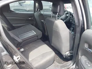 2014 Dodge Avenger SE z VIN 1C3CDZAG2EN232518, wystawiony jako IAAI lot #42157442 z przebiegiem 145 457 mil mil oraz . Historia ofert i sprzedaży dostępna na DreamBid. Obrazek 8.