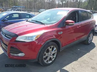 2013 Ford Escape SEL with VIN 1FMCU9H92DUD25669, listed as a IAAI auction lot 42070876 with 133,613 mi miles. Bid and sale history available at carsss.com. Image 2.