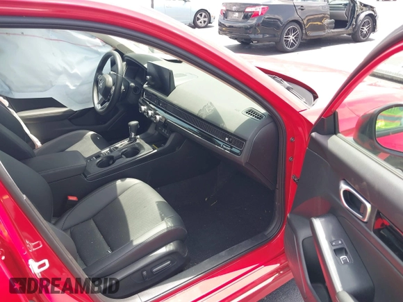 2023 Honda Civic Touring with VIN 2HGFE1F94PH323451, listed as a IAAI auction lot 42383422 with 6,120 mi miles and . Bid and sale history available at DreamBid. Image 5.