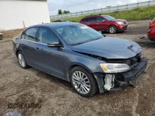 2014 Volkswagen Jetta TDI w/Premium with VIN 3VWLL7AJ6EM428743, listed as a Copart auction lot 63459355 with 145,814 mi miles and Salvage title. Bid and sale history available at DreamBid. Image 4.