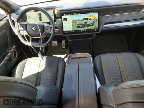 2022 Rivian R1T Adventure z VIN 7FCTGAAAXNN014983, wystawiony jako Copart lot #48987605 z przebiegiem Nie podano mil oraz Szkoda całkowita • Salvage title. Historia ofert i sprzedaży dostępna na DreamBid. Obrazek 8.