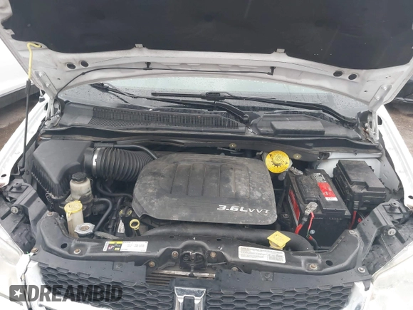 2014 Dodge Grand Caravan American Value with VIN 2C4RDGBG6ER378495, listed as a IAAI auction lot 42107034 with 167,820 mi miles and . Bid and sale history available at DreamBid. Image 10.