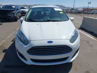 2014 Ford Fiesta SE z VIN 3FADP4BJ3EM183267, wystawiony jako IAAI lot #42058257 z przebiegiem 57 872 mil mil oraz . Historia ofert i sprzedaży dostępna na DreamBid. Obrazek 12.