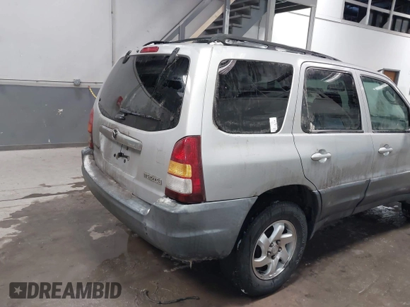 2003 Mazda Tribute DX with VIN 4F2YZ02B73KM43813, listed as a IAAI auction lot 41575708 with 202,214 mi miles and . Bid and sale history available at carsss.com. Image 4.