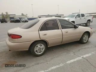 1999 Ford Escort LX z VIN 1FAFP10P2XW132084, wystawiony jako Copart lot #53642945 z przebiegiem 142 227 mil mil oraz Szkody całkowita. Historia ofert i sprzedaży dostępna na DreamBid. Obrazek 3.