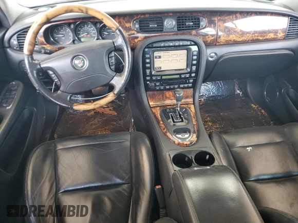 2004 Jaguar XJ с VIN SAJEA73B24TG10774, выставлен на аукционе Copart как лот 72577604 с пробегом 217 846 миль миль и Чистый • Clean title. История ставок и продаж доступна на DreamBid. Изображение 8.