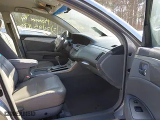 2006 Toyota Avalon XL with VIN 4T1BK36B46U147688, listed as a IAAI auction lot 41886568 with 210,581 mi miles. Bid and sale history available at carsss.com. Image 5.