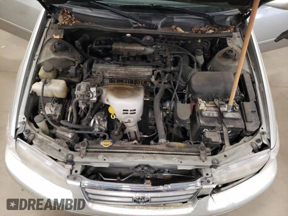 2000 Toyota Camry CE z VIN JT2BG22K1Y0483646, wystawiony jako Copart lot #53129705 z przebiegiem 187 418 mil mil oraz Szkoda całkowita • Salvage title. Historia ofert i sprzedaży dostępna na DreamBid. Obrazek 11.