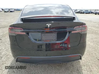 2022 Tesla Model X with VIN 7SAXCDE59NF360610, listed as a Copart auction lot 52575365 with 51,557 mi miles and Salvage Title. Bid and sale history available at carsss.com. Image 6.