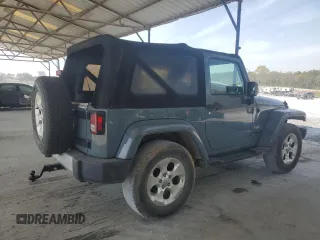 2015 Jeep Wrangler Sahara z VIN 1C4AJWBG9FL729104, wystawiony jako Copart lot #51065615 z przebiegiem 216 779 mil mil oraz Czysty tytuł • Clean title. Historia ofert i sprzedaży dostępna na DreamBid. Obrazek 3.
