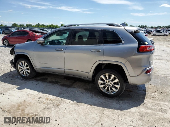 2016 Jeep Cherokee Overland z VIN 1C4PJMJSXGW300719, wystawiony jako Copart lot #58216665 z przebiegiem 128 016 mil mil oraz Szkoda całkowita • Salvage title. Historia ofert i sprzedaży dostępna na DreamBid. Obrazek 2.