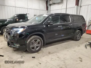 2021 Honda Ridgeline RTL-E z VIN 5FPYK3F71MB027712, wystawiony jako Copart lot #89169815 z przebiegiem 31 232 mil mil oraz Szkoda całkowita • Salvage title. Historia ofert i sprzedaży dostępna na DreamBid. Obrazek 1.