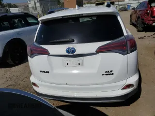 2016 Toyota RAV4 Hybrid XLE with VIN JTMRJREV2GD058966, listed as a Copart auction lot 58908824 with 0 mi miles and Salvage Title. Bid and sale history available at carsss.com. Image 6.